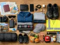 Zestaw podróżny: mapa, paszport, pieniądze, aparat, powerbank, ubrania, buty, czapka, kamizelka odblaskowa, latarka, apteczka, jedzenie. solutions recruitment bv.