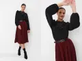 Eleganckie stylizacje damskie: czarna bluzka z koronkowym kołnierzykiem i marszczeniami, bordowa spódnica plisowana, czarny pasek z klamrą.