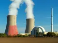 Dwie chłodnie kominowe i kopuła elektrowni atomowej, symbolizujące moc elektrowni atomowej w Polsce.