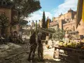 Scena z A Plague Tale: Requiem. Dwoje bohaterów obserwuje tętniący życiem targ przed zamkiem. Gra ma 17 rozdziałów.