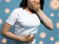 Kobieta z ręką na ustach i brzuchu, otoczona wirusami. Objawy jelitówki.