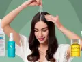 Kobieta aplikuje serum na skórę głowy, otoczona kosmetykami do włosów, w tym produktami z linii biomarine.