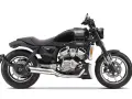 Czarny motocykl Hyosung GT 125 z widocznym silnikiem V-twin. Poznaj jego hyosung gt 125 dane techniczne i poczuj wolność na drodze.
