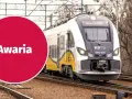 Pociąg KD stoi na torach, a czerwone koło z napisem "Awaria" sugeruje problem z zasilaniem, być może zerwana sieć trakcyjna.