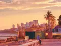 Zachód słońca nad Maputo, stolicą Mozambiku. W oddali widać panoramę miasta, a na pierwszym planie mężczyzna siedzi na murku.
