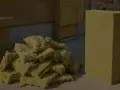 Stos wełny mineralnej i pojedynczy blok, gotowe do utylizacji. Materiał izolacyjny czeka na właściwe zagospodarowanie.