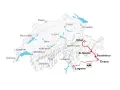 Map showing a scenic train route from Tirano to Lugano, passing through Poschiavo, St. Moritz, Chur, and Andermatt.