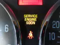 Dashboard lights show "SERVICE ENGINE SOON" and a seatbelt warning. This is a common indicator that it's time to figure out how to reset check engine light.