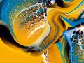 Vibrant yellow, blue, and white paint swirls create a mesmerizing cellular pattern, a testament to the ultimate pouring technique.