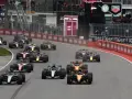Monoplazas compiten en el GP de Canadá, una carrera emocionante con varios coches luchando por la victoria.