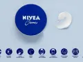 La crema Nivea es buena para la cara y para múltiples usos, como se muestra en los iconos: cuidado de la piel, masajes, protección y más.