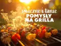 Szukasz co na grilla tanio? Aromatyczne szaszłyki z warzywami i mięsem pieką się na ruszcie w blasku zachodzącego słońca.