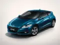 Niebieskie coupe Honda CR-Z z napędem hybrydowym na białym tle.