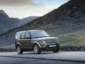 Brązowy Land Rover Discovery 4 na tle górskich krajobrazów. Nawet w tak malowniczym miejscu mogą pojawić się land rover discovery 4 awarie i problemy.