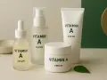 En samling hudvårdsprodukter med vitamin A, inklusive serum och krämer, för en strålande hud.