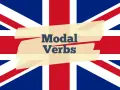 Die britische Flagge mit dem Text "Modal Verbs" auf einem hellgelben Band.