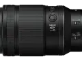 Objectif NIKKOR S noir avec boutons DISP, L-Fn, sélecteurs A/M et de mise au point. Le vr signification est la stabilisation optique.