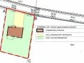 Fragment planu zagospodarowania przestrzennego: projektowany budynek, nawierzchnie utwardzone i powierzchnia biologicznie czynna.