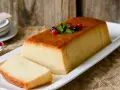 Un delicioso pudin tradicional, decorado con frutos rojos y menta. Perfecto para tu próxima receta.
