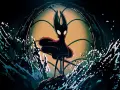 Hornet, con su capa roja ondeando, se alza sobre una roca rodeada de salpicaduras de agua. El fondo evoca la atmósfera de Silksong DLC.