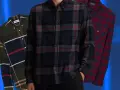 Tre camicie a quadri da uomo: una verde con blocchi di colore, una blu scuro con quadri rossi e grigi, e una rossa con quadri blu. Perfette per un outfit camicia flanella uomo.