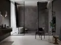 Bagno moderno con vasca freestanding e docce senza piatto, pareti in gres effetto marmo, arredi minimalisti e illuminazione soffusa.