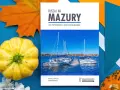 Przewodnik "Ruszaj na Mazury" z widokiem na żaglówki i miasteczko. Idealny na podróż po krainie tysiąca jezior.