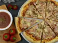 Pizza Capricciosa: Skład, historia i sekrety "kapryśnej" królowej