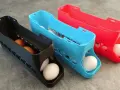 3D printed egg holders in black, blue, and red. See what you can do with a 3d printer: create practical kitchen organizers!