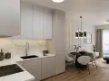 Nowoczesna kuchnia i salon w stanie deweloperskim. Jasne meble, marmurowe płytki, czarny stół z krzesłami i duży balkon z widokiem.
