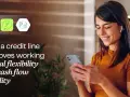A woman smiles while looking at her phone, with icons representing financial flexibility and a working capital line of credit.