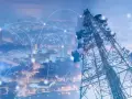 A telecommunications tower overlooks a city, with glowing lines connecting points, symbolizing network planning and optimization.