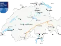 Map showing the Grand Train Tour of Switzerland. The route from Zermatt to Lugano is highlighted in orange, passing through Visp, Brig, Andermatt, and Locarno.