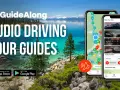 Piękne jezioro Tahoe z górami w tle. Obok dwa telefony z aplikacją GuideAlong - audio przewodniki po trasach, idealne na wycieczkę nad jezioro Tahoe.