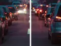 Luci sfocate e distorte nel traffico, come vedono i miopi astigmatici. Un'esperienza visiva caotica e abbagliante.