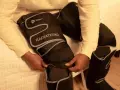 Person zips up leg compression machine. Consult your doctor on how long should you use leg compression machine for best results.