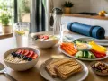 Petit-déjeuner sain pour le sport d'endurance : porridge aux fruits, toasts au beurre de cacahuète, légumes et fruits secs.