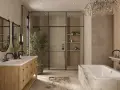 A modern bathroom remodel featuring a wooden vanity, glass shower, and marble bathtub.