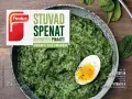En skål med krämig stuvad spenat, toppad med ett halvt kokt ägg. Findus logotyp syns tydligt.