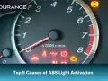 Dashboard with illuminated ABS light and other warning indicators. Learn the top 5 causes of ABS light activation.