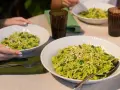 Due piatti di trofie al pesto, condite con fagiolini e pinoli, pronte per essere gustate.