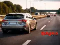 Szary kombi jedzie autostradą. Zastanawiasz się, ile można jechać na autostradzie? Z Bajką nauczysz się wszystkiego!