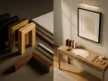 Pièces de bois et de métal pour faire un encadrement, avec un tableau déjà encadré sur une console.