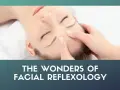 A close-up of a woman's face as gentle fingers perform facial reflexology, promoting relaxation and well-being.