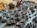 Vasta collezione di miniature per Forge World 40k: demoni, creature mostruose e veicoli da battaglia pronti per la guerra.