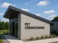 Nowoczesny budynek krematorium dla zwierząt z napisem "PET CREMATORIUM".