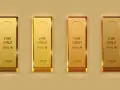 Quattro lingotti d'oro puro 999.9, ognuno da 1 chilo, brillano con la loro intrinseca densità oro.
