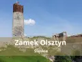 Zamek Olsztyn, ruiny średniowiecznej warowni na Jurze Krakowsko-Częstochowskiej, dumnie wznosi się na tle błękitnego nieba.