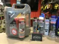 Duży kanister oleju Liqui Moly TOP TEC 4100 5W-40 z dodatkiem do filtra DPF. Obok różne preparaty, m.in. do czyszczenia układu paliwowego i chłodnicy.