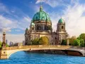 A stunning view of Berlin Cathedral across the Spree River, perfect for your next travel to Berlin.